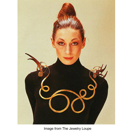 Anjelica Huston wearing Alexander Calder's "The Jealous Husband" necklace made of brass wire