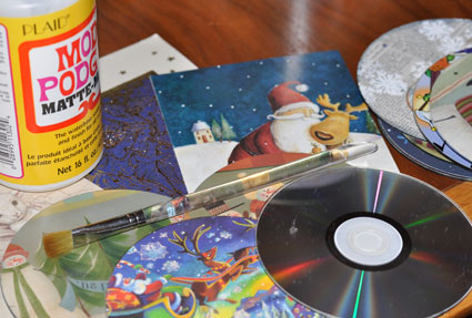 Make ornaments from old CDs with holiday cards and Mod Podge.