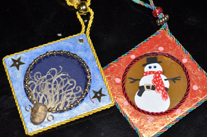 Coin envelope ornaments designed and handpainted by Graphic Artist Jann Bell.