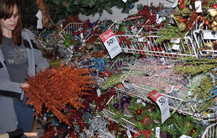 Counting stems in the glittery holiday aisle.