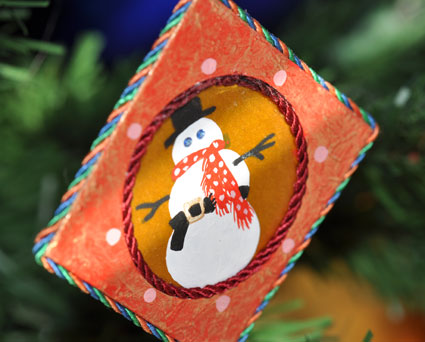 Detail of Jann's hand painted snowman with crystal blue eyes.