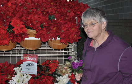 My Mtom lookiing at poinsettias